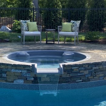 Dex by Terra - Hot tub spillway set off by a beautiful wall. - General Contractors Near Me - Hudson, Massachusetts