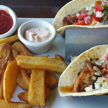 Rusty Pelican - Mahi Mahi Fish Tacos and fries. This dish was perfect. The fish was fresh and tender. Probably the best fish tacos I've had. - Seafood Near Me - Tampa, Florida Rusty Pelican - Mahi Mahi Fish Tacos and fries. This dish was perfect. The fish was fresh and tender. Probably the best fish tacos I've had. - Seafood Near Me - Tampa, Florida