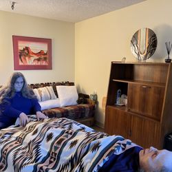 Trillium Healing & Arts - Shows me giving HT & Reiki. Rest of therapy room in view.