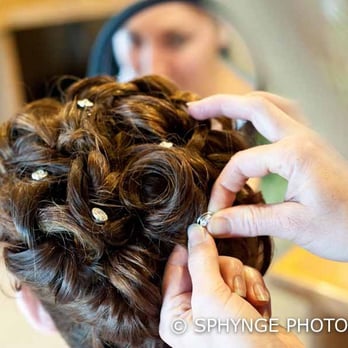 Hair By Heidi - Heidi working on bridesmaid's curly updo and adjusting details - Hair Stylists Near Me - San Jose, California Hair By Heidi - Heidi working on bridesmaid's curly updo and adjusting details - Hair Stylists Near Me - San Jose, California