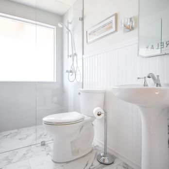 Devine Bath - a white bathroom with a marble floor - General Contractors Near Me - Portland, Oregon