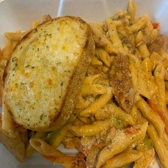 J &T's Kitchen Detroit - a plate of pasta with a piece of bread - Mexican Near Me J &T's Kitchen Detroit - a plate of pasta with a piece of bread - Mexican Near Me