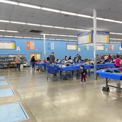 Goodwill 2nd Chance Outlet - Hard goods are on shelves around the outside of the room.