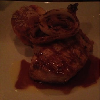 Fat Canary - Pork chop with goat cheese soufflé and apple sauce... Very special. Best pork chops I have had in a very long time. - New American Near Me - Williamsburg, Virginia