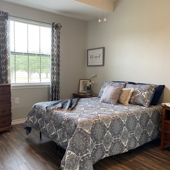 Courtyards at Lake Granbury - Master bedroom of our 2 bedroom floor plan. - Retirement Homes Near Me - Granbury, Texas Courtyards at Lake Granbury - Master bedroom of our 2 bedroom floor plan. - Retirement Homes Near Me - Granbury, Texas