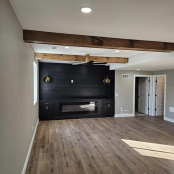 Promax Contracting - an empty living room with a fireplace - General Contractors Near Me - Chesterfield, Missouri