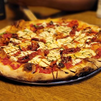 Rotolo's Craft & Crust - a pizza on a table - Pizza Near Me - Baton Rouge, Louisiana Rotolo's Craft & Crust - a pizza on a table - Pizza Near Me - Baton Rouge, Louisiana