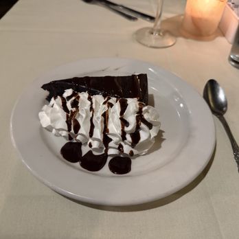 Ferguson Chophouse - Chocolate cake with whipped cream and chocolate sauce. - Steakhouses Near Me - Ferguson, Missouri Ferguson Chophouse - Chocolate cake with whipped cream and chocolate sauce. - Steakhouses Near Me - Ferguson, Missouri