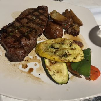 Cafe Buenos Aires - BIFE DE LOMO Grilled Argentine style, roasted potatoes and seasonal vegetable - Latin American Near Me - Huntington, New York