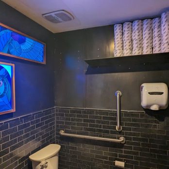 Ermanos Bar - Unique bathroom decorBlack light owl and wings - Wine Bars Near Me - Tucson, Arizona Ermanos Bar - Unique bathroom decorBlack light owl and wings - Wine Bars Near Me - Tucson, Arizona