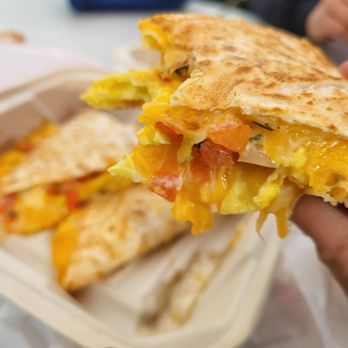Antojitos - a person holding a sandwich - Latin American Near Me - Burbank, California