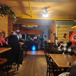Amigos Mexican Cantina - The person singing....the "DJ"  because there's no one else singing