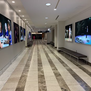 Atlanta Symphony Hall - a long hallway with a bench and televisions - Music Venues Near Me - Atlanta, Georgia Atlanta Symphony Hall - a long hallway with a bench and televisions - Music Venues Near Me - Atlanta, Georgia