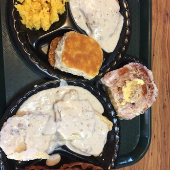 Grandy's - Biscuits and gravy, sinnamon roll topped with butter, chicken friend chicken, hash browns, scrambled eggs, bacon, and a biscuit. - Breakfast & Brunch Near Me - El Paso, Texas