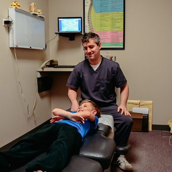 Plainfield Spine And Rehabilitation, Dr. McCarthy Chiropractor - Dr. Paul McCarthy adjusting a patient - Chiropractors Near Me - Plainfield, Illinois