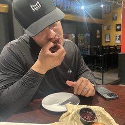 Hubby enjoying the jalapeño poppers with homemade jam to dip them in!