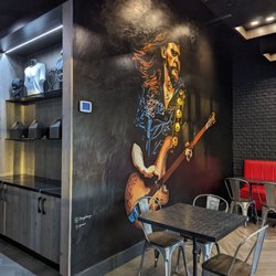 Slayer Burger - Merch in the nook with huge mural