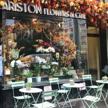 Ariston Flowers & Cafe - Vibrant theme of autumn leaves as the storefront decoration - Coffee & Tea Near Me - New York, New York Ariston Flowers & Cafe - Vibrant theme of autumn leaves as the storefront decoration - Coffee & Tea Near Me - New York, New York