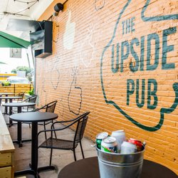 The Upside Pub - outdoor patio with TVs and umbrellas