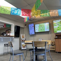 Fresh And Natural Mexican Eatery - Seating area and menu