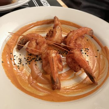 Century Manor - a plate of shrimp skewers with sauce - New American Near Me - Olean, New York