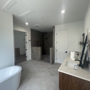 DLF Contractor - a bathroom with a large tub and a walk in shower - General Contractors Near Me - Springfield, Virginia DLF Contractor - a bathroom with a large tub and a walk in shower - General Contractors Near Me - Springfield, Virginia