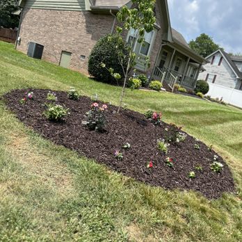 All Things Green - a house and a flower bed - Lawn Services Near Me All Things Green - a house and a flower bed - Lawn Services Near Me