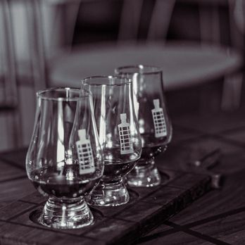 New Artisan Distillery - three glasses of brandy on a cutting board - Distilleries Near Me - Dallas, Texas New Artisan Distillery - three glasses of brandy on a cutting board - Distilleries Near Me - Dallas, Texas