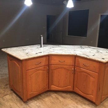 Coast Granite Creations - This is the island with one of the electrical outlets pulled up for use. They go flush when not in use. - Flooring Near Me - Coquille, Oregon