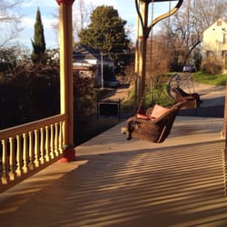 Ahern's Belle Of The Bends Bed And Breakfast - Porch swings on all levels.