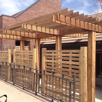 Probuilt Patio Enclosures - Outdoor patio red door grill. - General Contractors Near Me - Kansas City, Missouri Probuilt Patio Enclosures - Outdoor patio red door grill. - General Contractors Near Me - Kansas City, Missouri