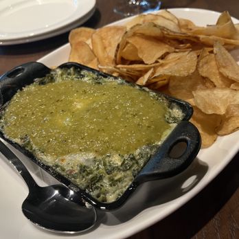 Bennett's Westside Grill - Spinach dip with their homemade potato chips! They top their spinach dip with a green jalapeño salsa and it is amazing. - American Near Me - Rocklin, California