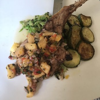 Babes Grill House - Pork chop with pineapple salsa, sides of sautéed zucchini and Brussels sprouts - New American Near Me - Palmyra, Pennsylvania Babes Grill House - Pork chop with pineapple salsa, sides of sautéed zucchini and Brussels sprouts - New American Near Me - Palmyra, Pennsylvania