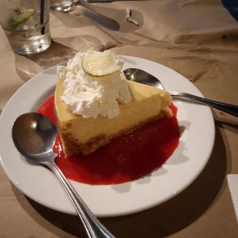 1885 Grill - A "little" slice of key lime pie surrounded by raspberry sauce - Seafood Near Me - Chattanooga, Tennessee