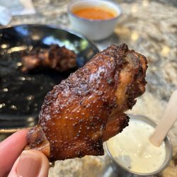 The Backyard - Smoked buffalo wings with sauce on side