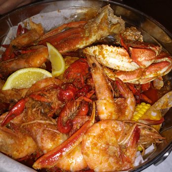 The Boiling House - Snow crab cluster, Dungeness crab cluster, the largest Shrimp I've ever seen, Crawfish, potatoes & corn in their garlic butter mild.. - Cajun/Creole Near Me - Cherry Hill, New Jersey