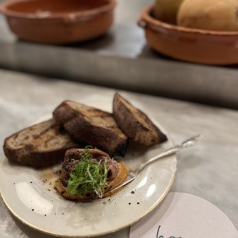 Homer - Sardine with Harissa Butter and Grilled Sourdough Bread - Mediterranean Near Me - Seattle, Washington Homer - Sardine with Harissa Butter and Grilled Sourdough Bread - Mediterranean Near Me - Seattle, Washington