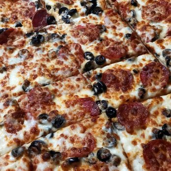 Uncle Nick's Pizza - Chicago cut XL white pizza with pepperoni, black olives & garlic - perfection! - Pizza Near Me - Port Charlotte, Florida