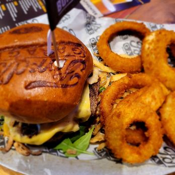 Ford's Garage Wesley Chapel - Estate burger with onion rings - Burgers Near Me - Lutz, Florida Ford's Garage Wesley Chapel - Estate burger with onion rings - Burgers Near Me - Lutz, Florida