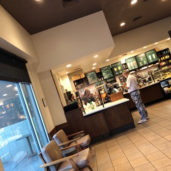 Starbucks - a man standing in a coffee shop - Coffee & Tea Near Me - Albuquerque, New Mexico