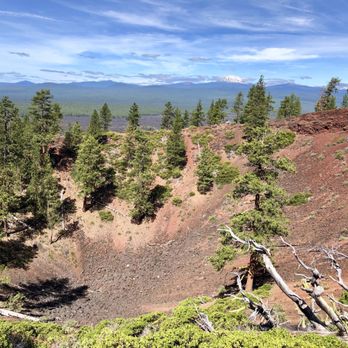 Newberry National Volcanic Monument - Mt. Bachelor looms in the distance of the Lava Butte crater (one of the volcano's cinder cones that erupted 7,000 years ago) - Landmarks & Historical Buildings Near Me - Bend, Oregon