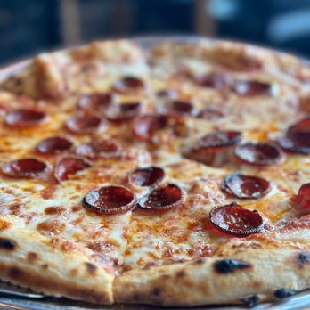 The Mercantile - a pepperoni pizza on a metal tray - New American Near Me - Worcester, Massachusetts