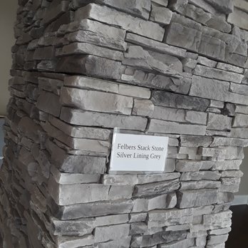 LJ Construction - a stack of stacked stone - Roofing Near Me - Lancaster, New York