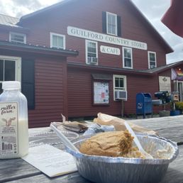 a bowl of bread and a bottle of milk