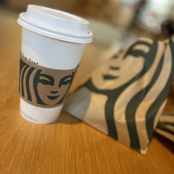 Starbucks - a starbucks cup and a bag on a table - Coffee & Tea Near Me - Dallas, Texas Starbucks - a starbucks cup and a bag on a table - Coffee & Tea Near Me - Dallas, Texas