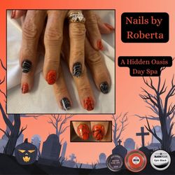 A Hidden Oasis Day Spa - Halloween perfection!
Roberta created this black and orange alternating design for Sharon, finished with white and black spider gel a