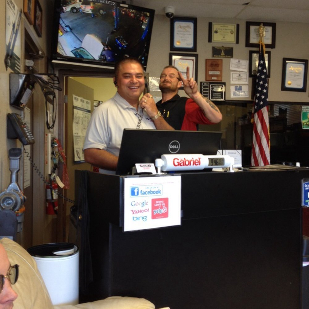 Plus One Performance - This is the owner getting photo bombed by one of his technicians. - Tires Near Me - Highland, California Plus One Performance - This is the owner getting photo bombed by one of his technicians. - Tires Near Me - Highland, California