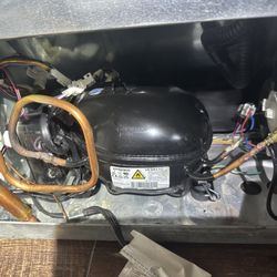 Fixing seal system leak and compressor issue on refrigerator.