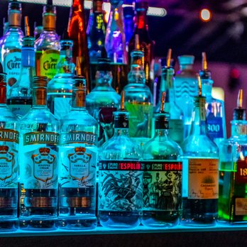 RockHouse LIVE - bottles of alcohol on a bar counter - American Near Me - Clearwater, Florida RockHouse LIVE - bottles of alcohol on a bar counter - American Near Me - Clearwater, Florida