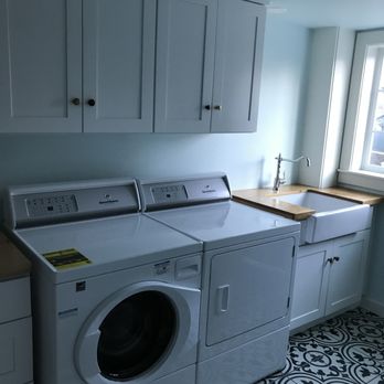 Tello General Contractor - a washer and dryer in a laundry room - General Contractors Near Me Tello General Contractor - a washer and dryer in a laundry room - General Contractors Near Me